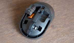 The Dell KM555 mouse with the top cover removed.