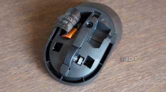 The Dell KM555 mouse with the top cover removed.