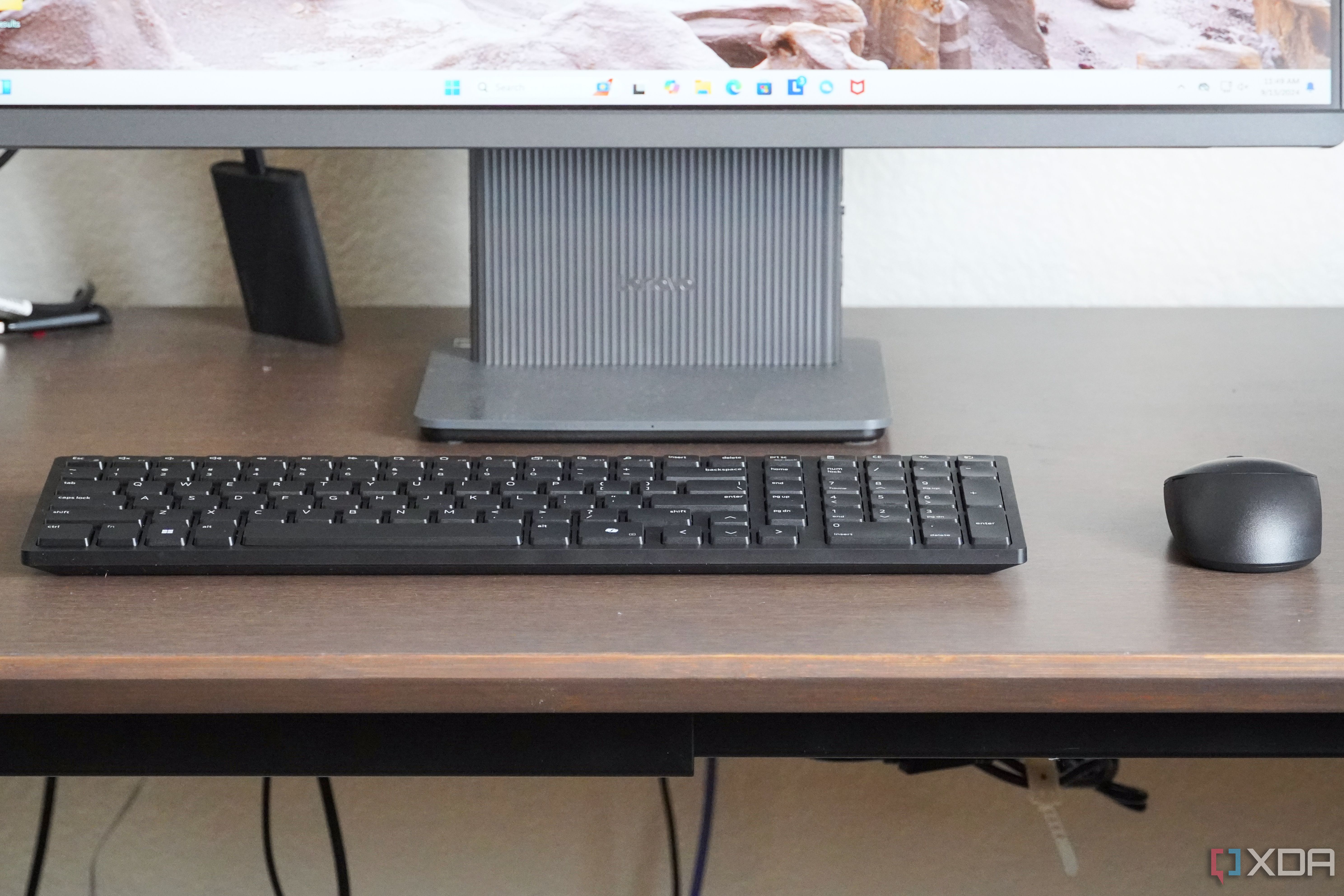 The Dell KM555 keyboard and mouse on a desk.