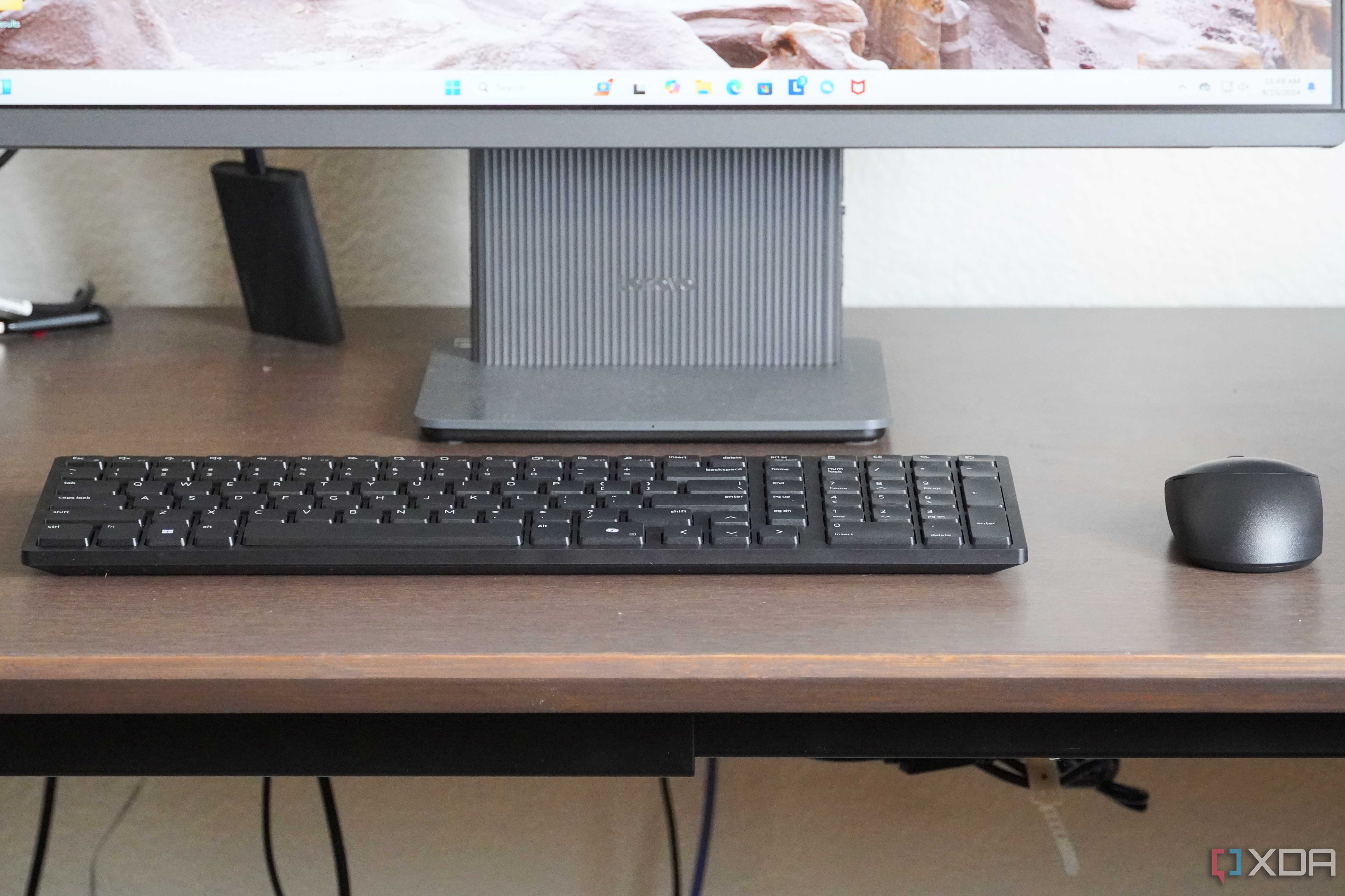 The Dell KM555 keyboard and mouse on a desk.