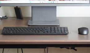 The Dell KM555 keyboard and mouse on a desk.