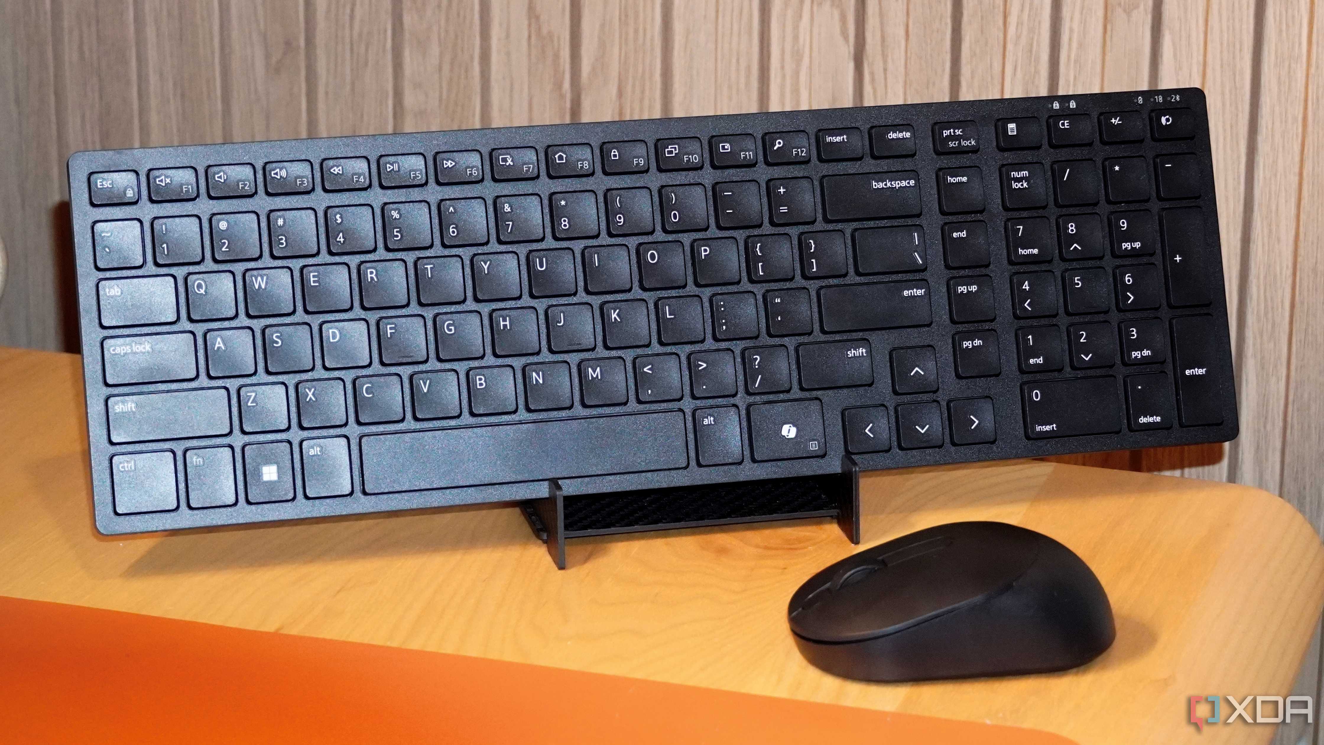 The Dell KM555 keyboard on a stand.
