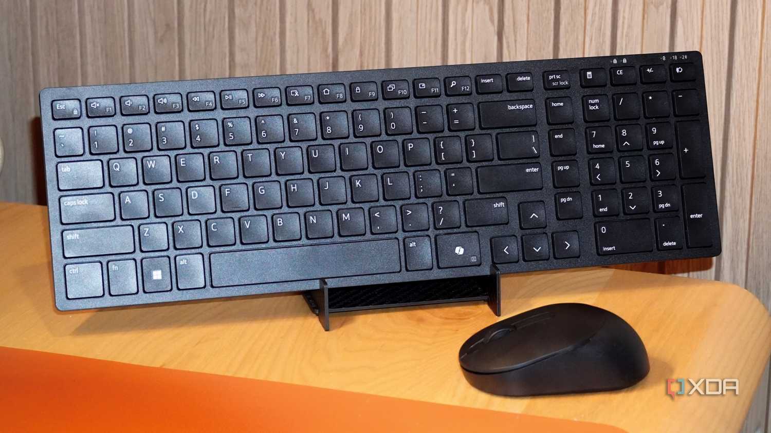 The Dell KM555 keyboard on a stand.