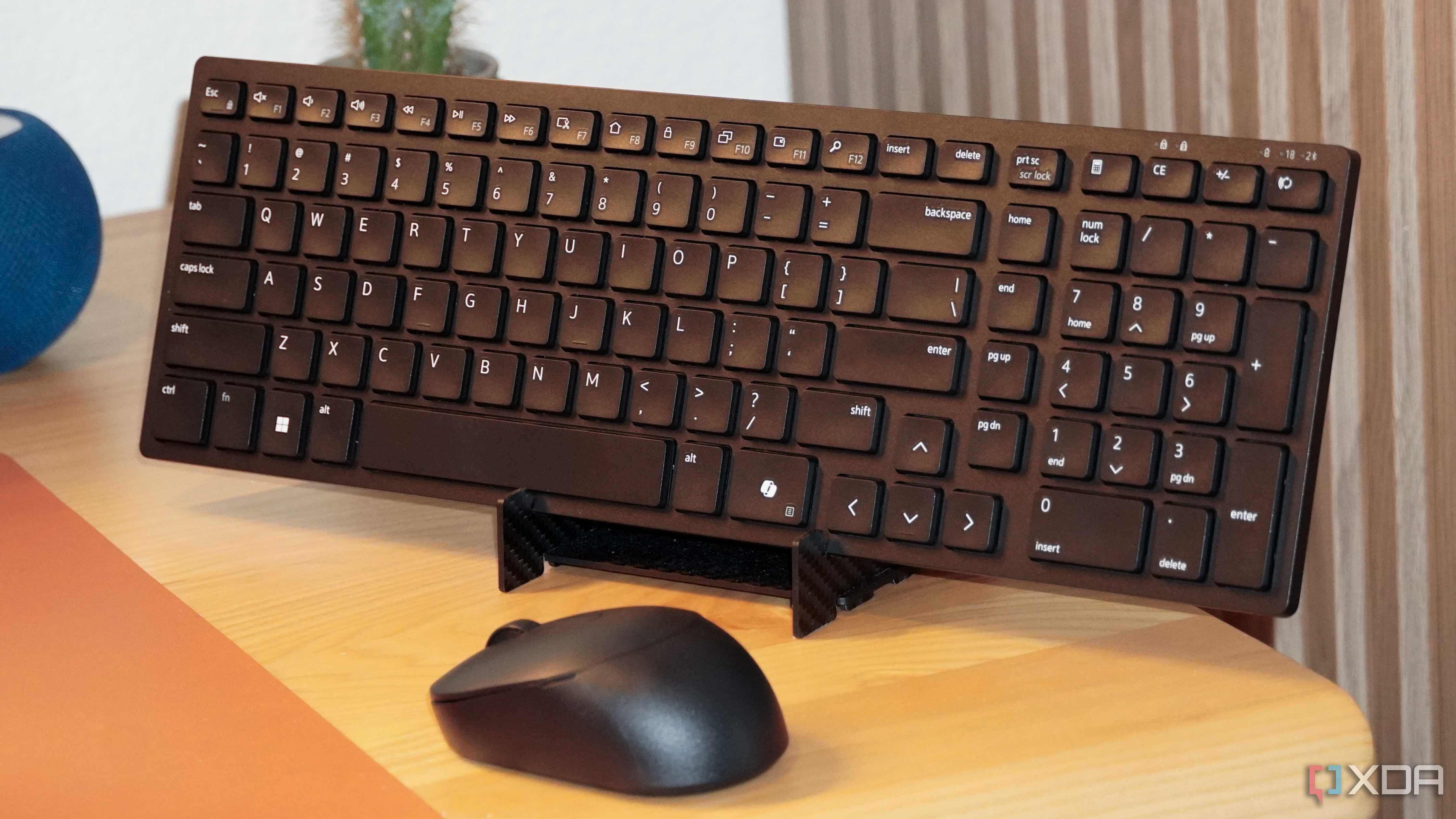The Dell KM555 keyboard and mouse on a stand.