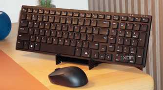 The Dell KM555 keyboard and mouse on a stand.