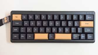 Top view of a black mechanical keyboard on a white surface