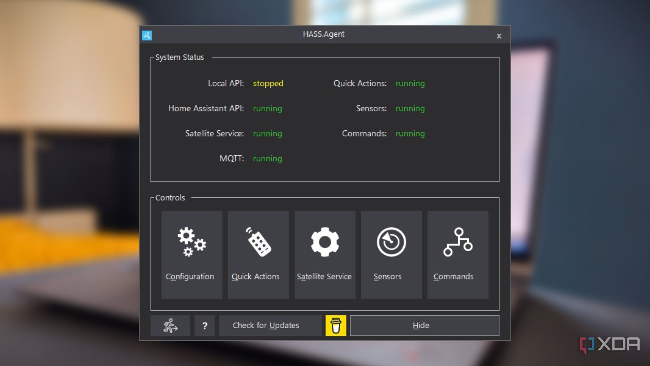 screenshot of hass.agent for home assistant floating over a blurred background of a laptop computer