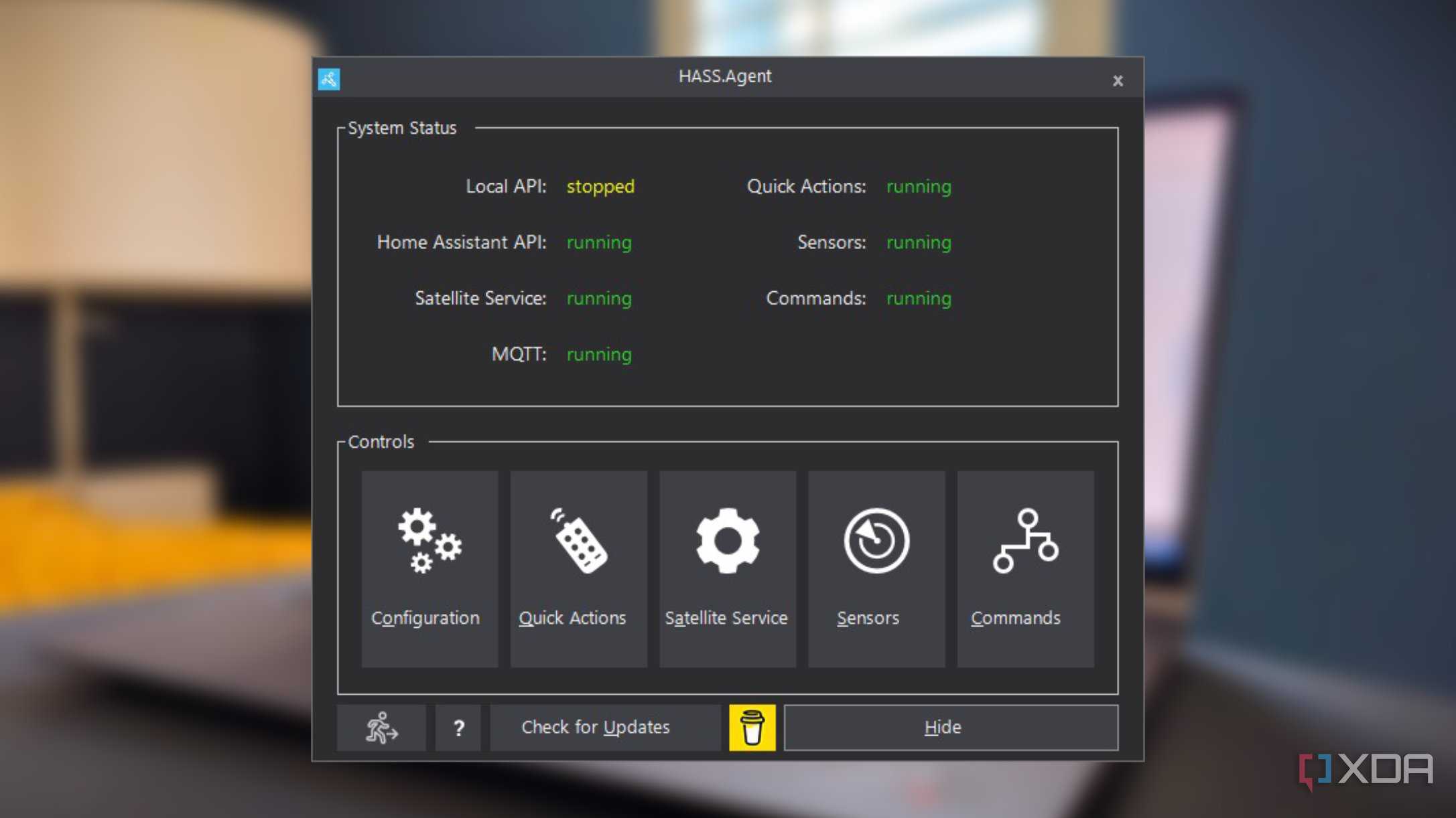 screenshot of hass.agent for home assistant floating over a blurred background of a laptop computer