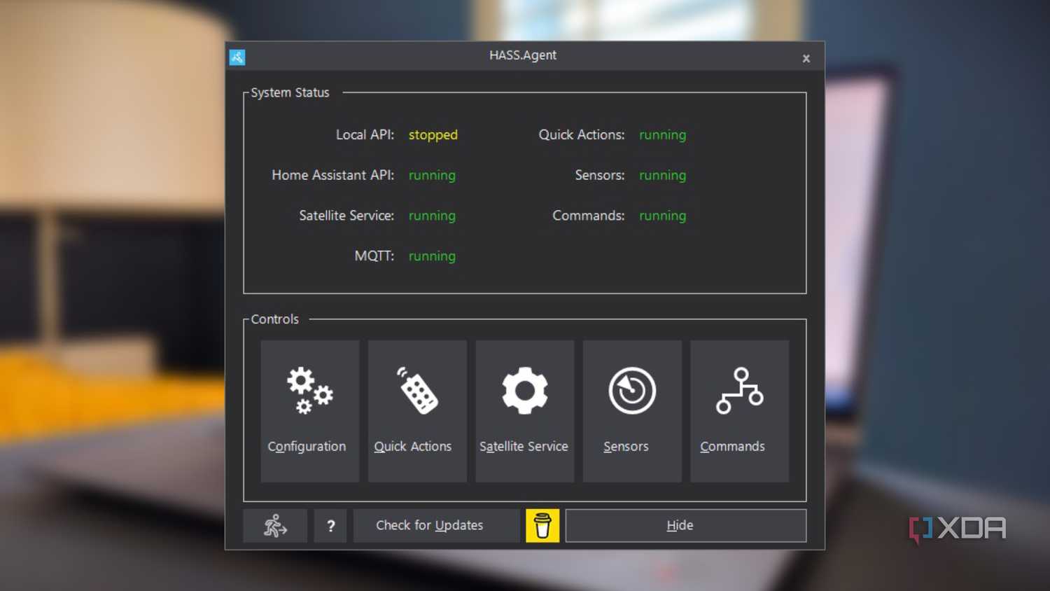 screenshot of hass.agent for home assistant floating over a blurred background of a laptop computer