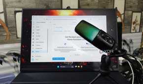A microphone kept in front of a monitor running the Home Assistant UI