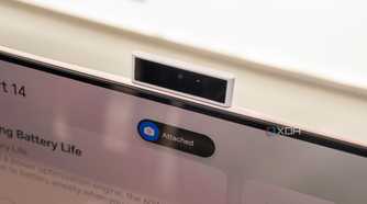 Close-up oof the magnetic webcam attached to the Honor MagicBook Art 14 with a pop-up on screen indicating the webcam is connected