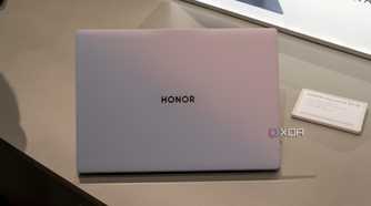The sunrise white Honor MagicBook Art 14 seen from the back with the lid open