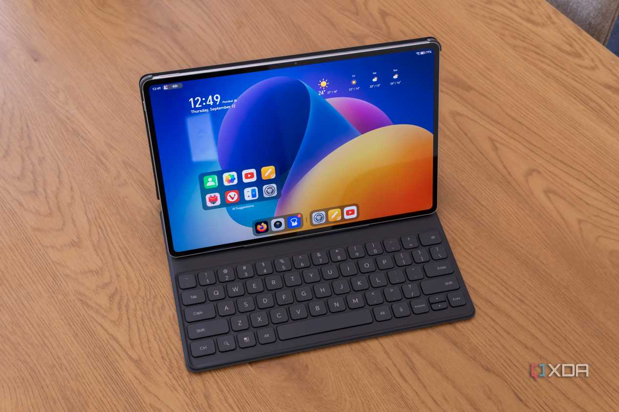 Angled view of the Honor MagicPad 2 inside the Smart Keyboard accessory, displaying the Home screen