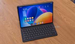Angled view of the Honor MagicPad 2 inside the Smart Keyboard accessory, displaying the Home screen