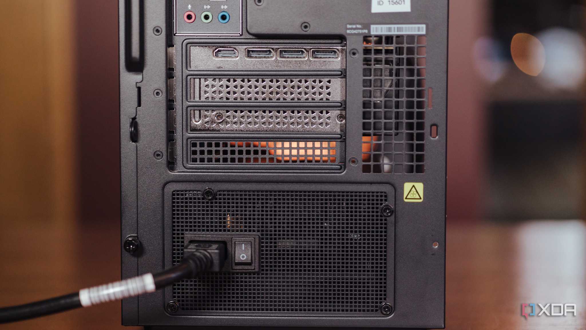 Rear-facing switch on a power supply installed in a tower-style PC case