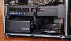 Lower half of a gaming PC case with a Geforce RTX graphics card and 1000W PSU