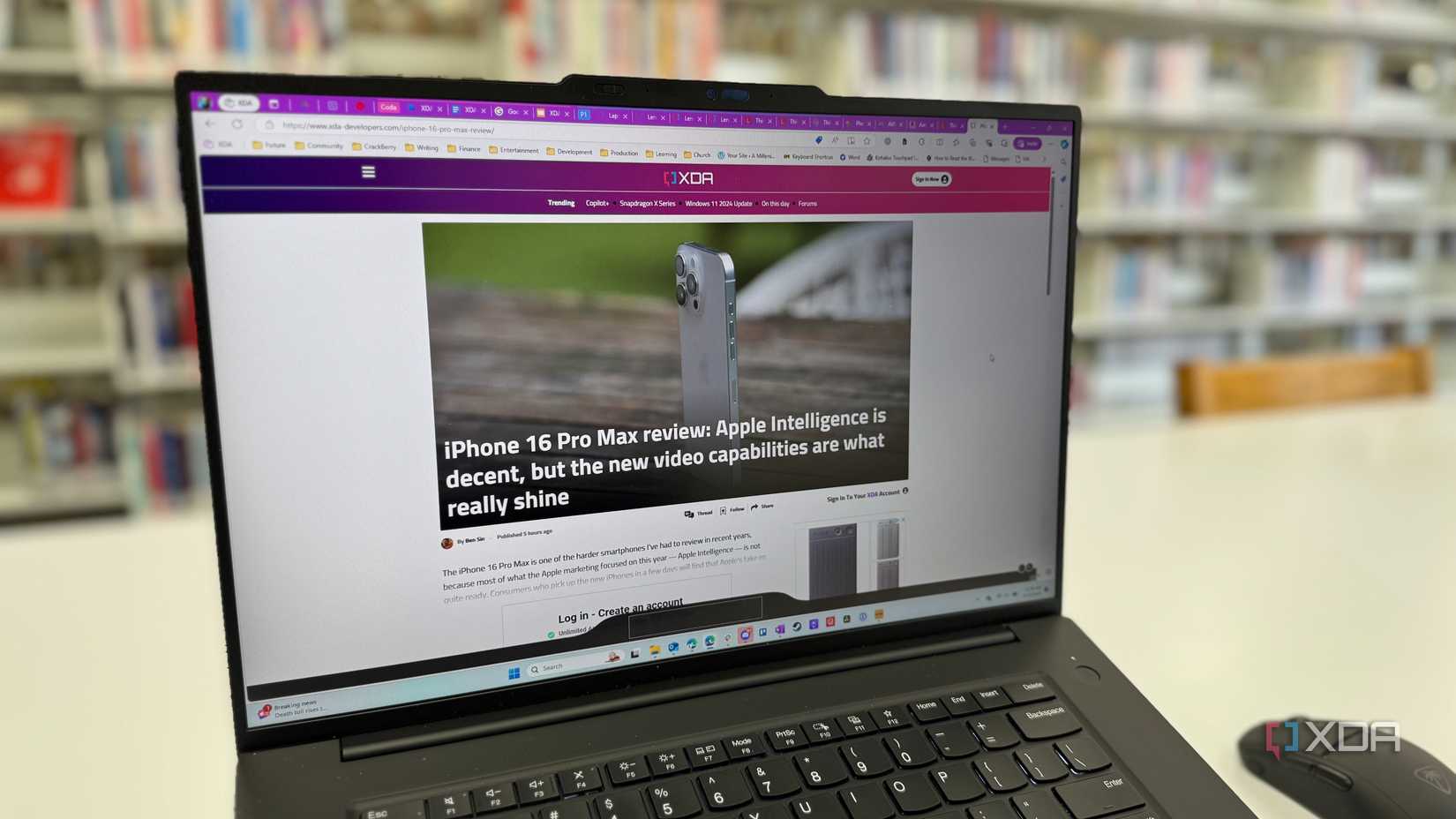 The display on the Lenovo P16 Gen 7 on a white table with bookshelves in the background