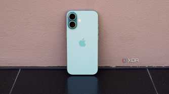The iPhone 16 leaning against a wall in teal.