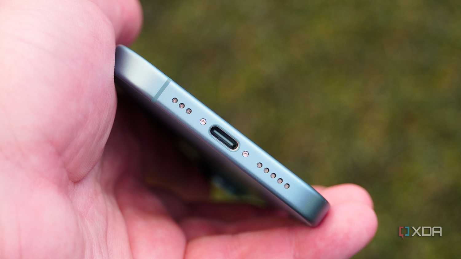 The USB-C port on the bottom of the iPhone 16.