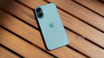 The iPhone 16 on a table outdoors.
