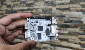 A person holding the Libre Computer La Frite AML-S805X-AC SBC