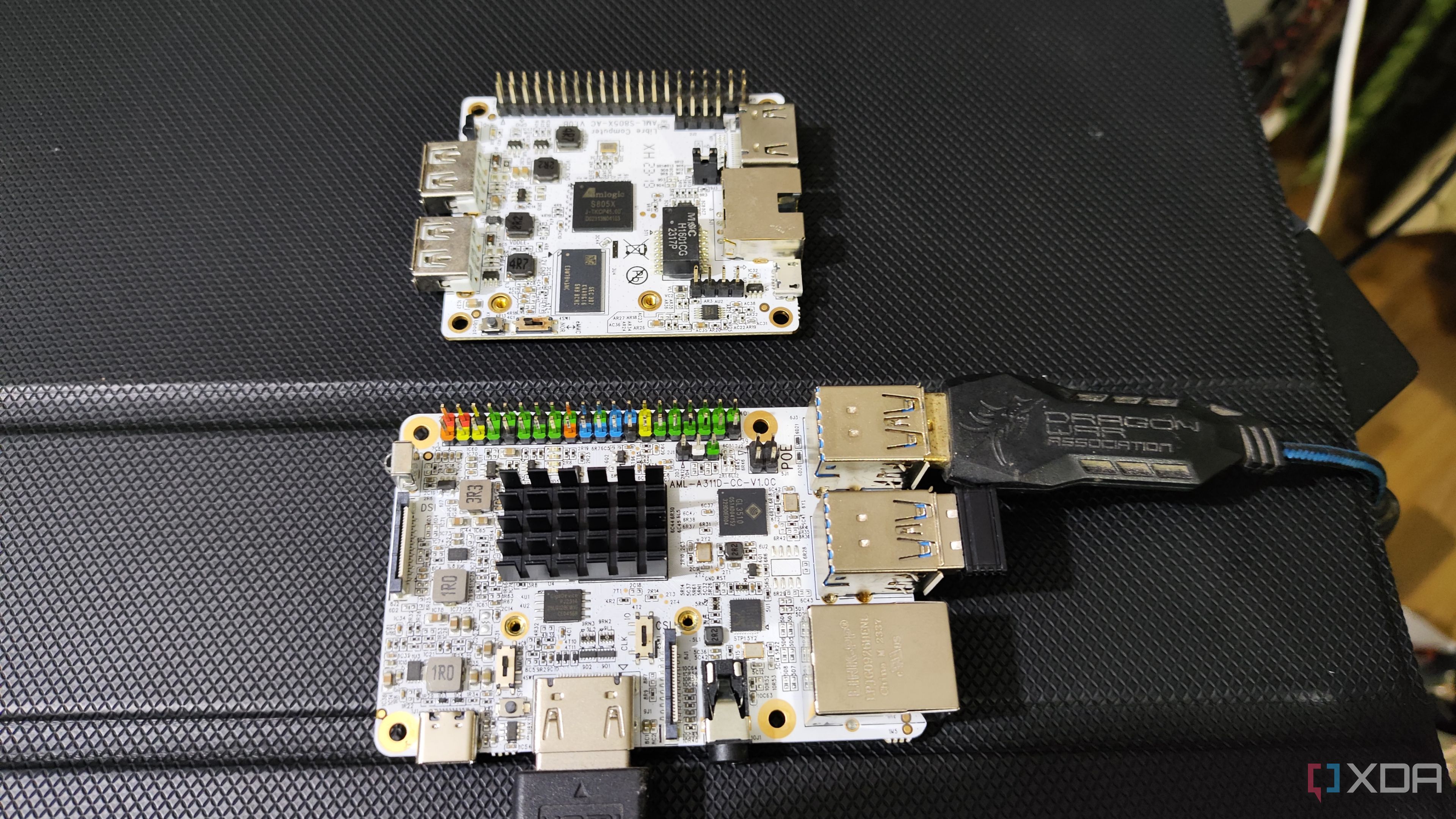 A Libre Computer La Frite AML-S805X-AC SBC placed near an Alta AML-A311D-CC AI SBC