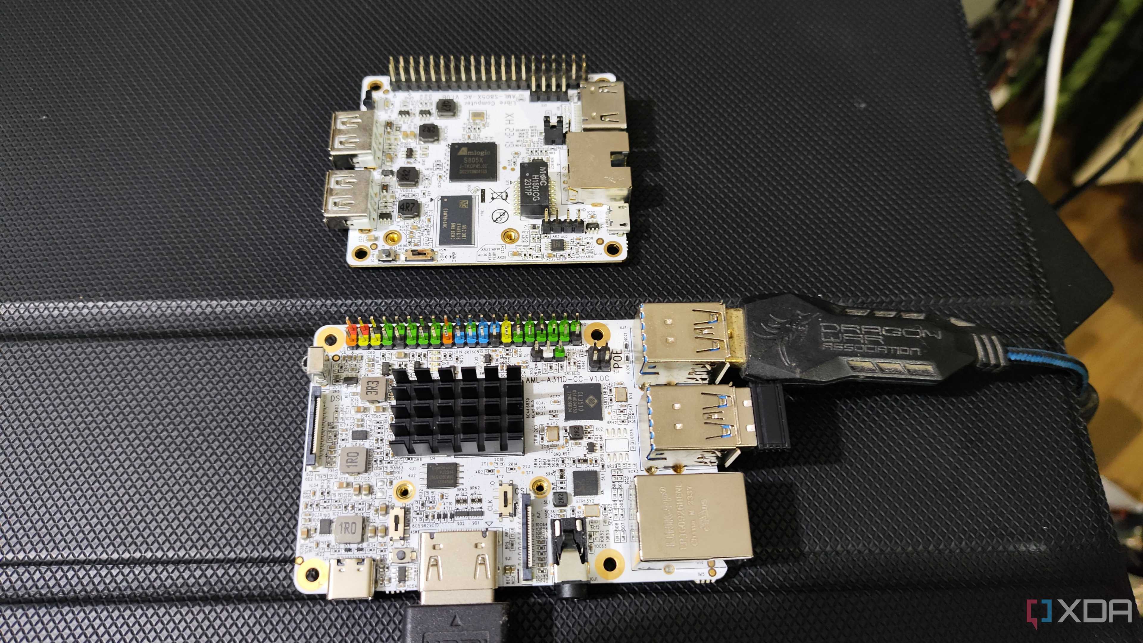 A Libre Computer La Frite AML-S805X-AC SBC placed near an Alta AML-A311D-CC AI SBC