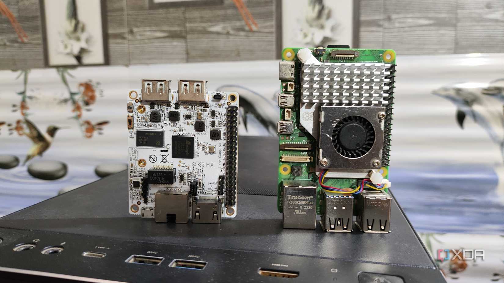 A Libre Computer La Frite AML-S805X-AC SBC placed near a Raspberry Pi 5
