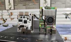 A Libre Computer La Frite AML-S805X-AC SBC placed near a Raspberry Pi 5