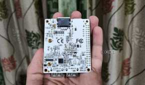 A person holding a Libre Computer La Frite AML-S805X-AC SBC