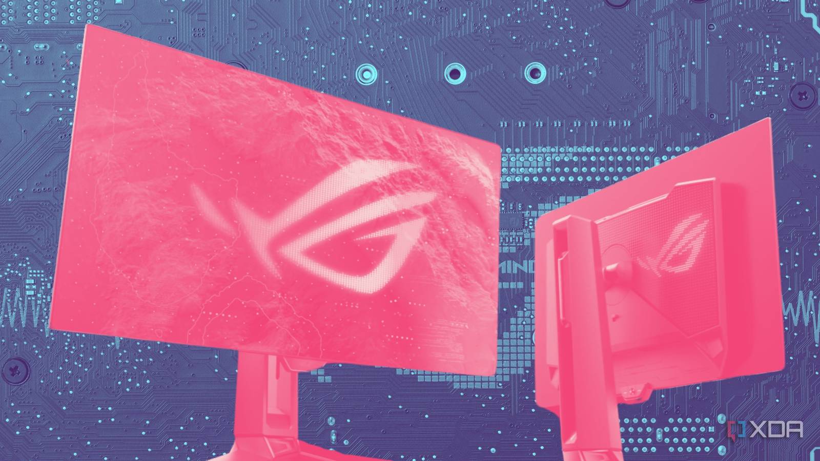 An Asus monitor with a pink highlight over a circuit board background