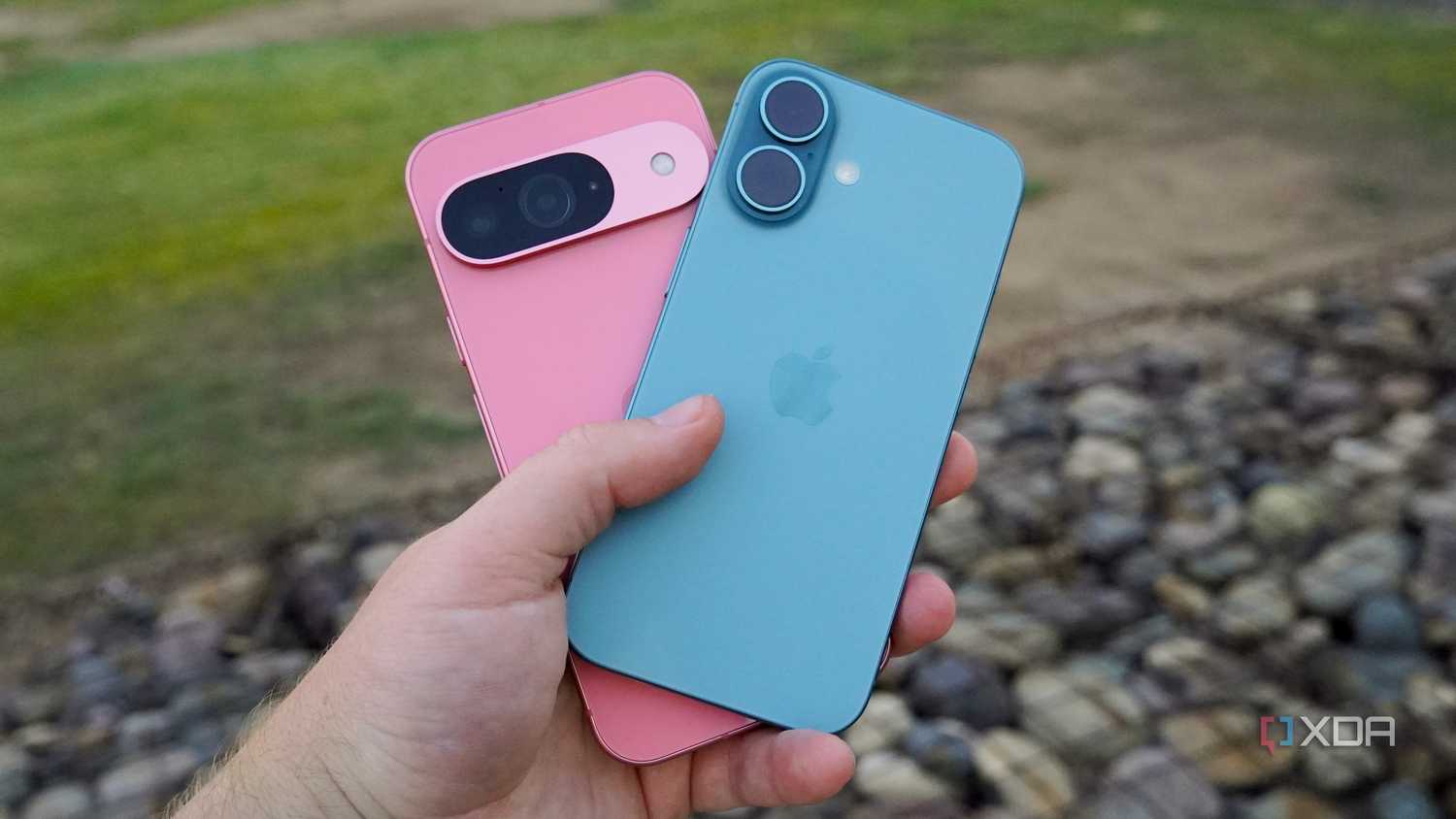 Holding the Pixel 9 and iPhone 16 in the hand.