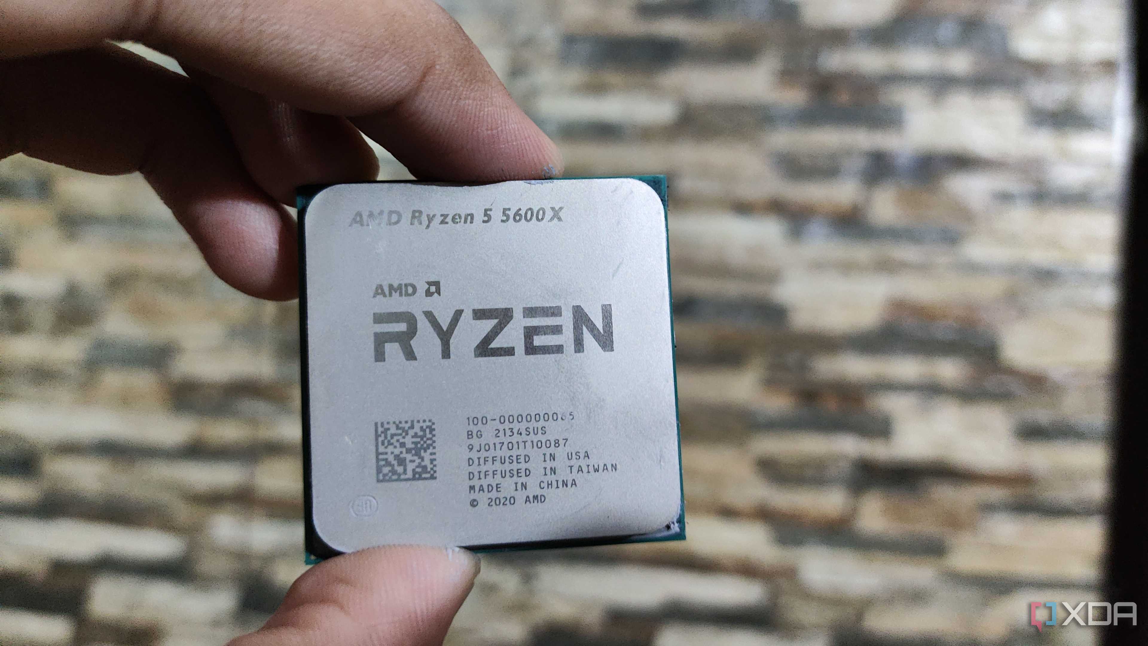 A person holding a Ryzen 5 5600X