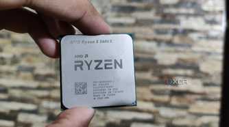 A person holding a Ryzen 5 5600X