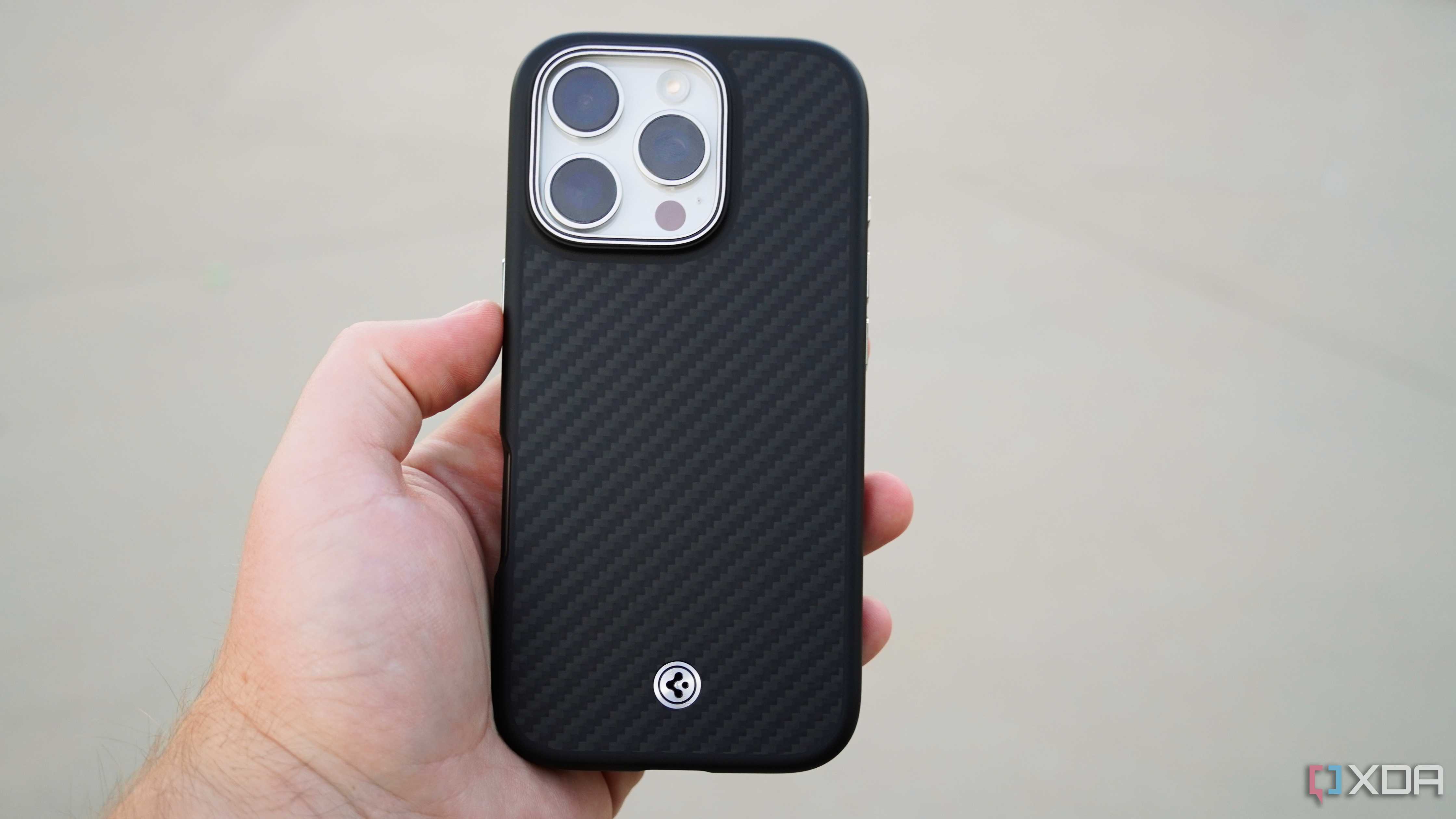 The Spigen Enzo Aramid Fiber case on an iPhone 16 Pro.