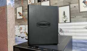 A TerraMaster F8 SSD Plus NAS placed on top of a PC