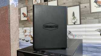 A TerraMaster F8 SSD Plus NAS placed on top of a PC