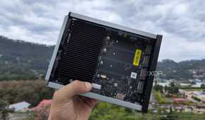 A person holding a TerraMaster F8 SSD Plus NAS
