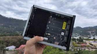 A person holding a TerraMaster F8 SSD Plus NAS