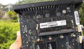 A person holding a TerraMaster F8 SSD Plus NAS