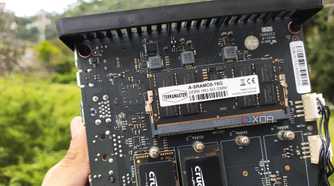 A person holding a TerraMaster F8 SSD Plus NAS