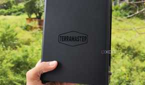 A person holding a TerraMaster F8 SSD Plus NAS