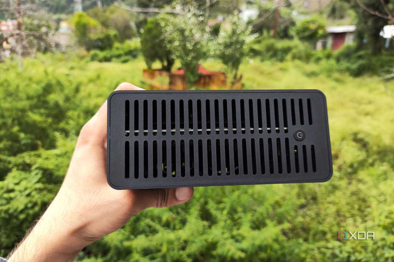 A person holding a TerraMaster F8 SSD Plus NAS