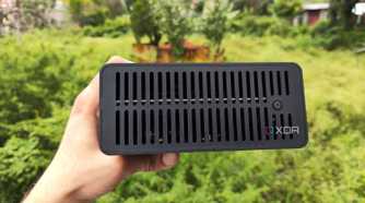 A person holding a TerraMaster F8 SSD Plus NAS