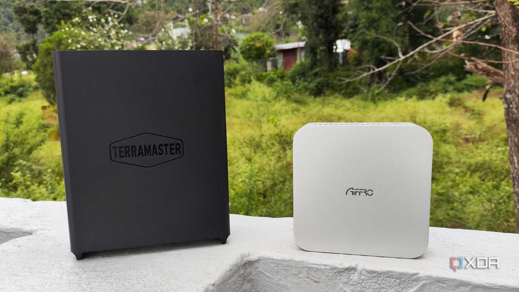 A TerraMaster F8 SSD Plus placed near an Aiffro K100 NAS