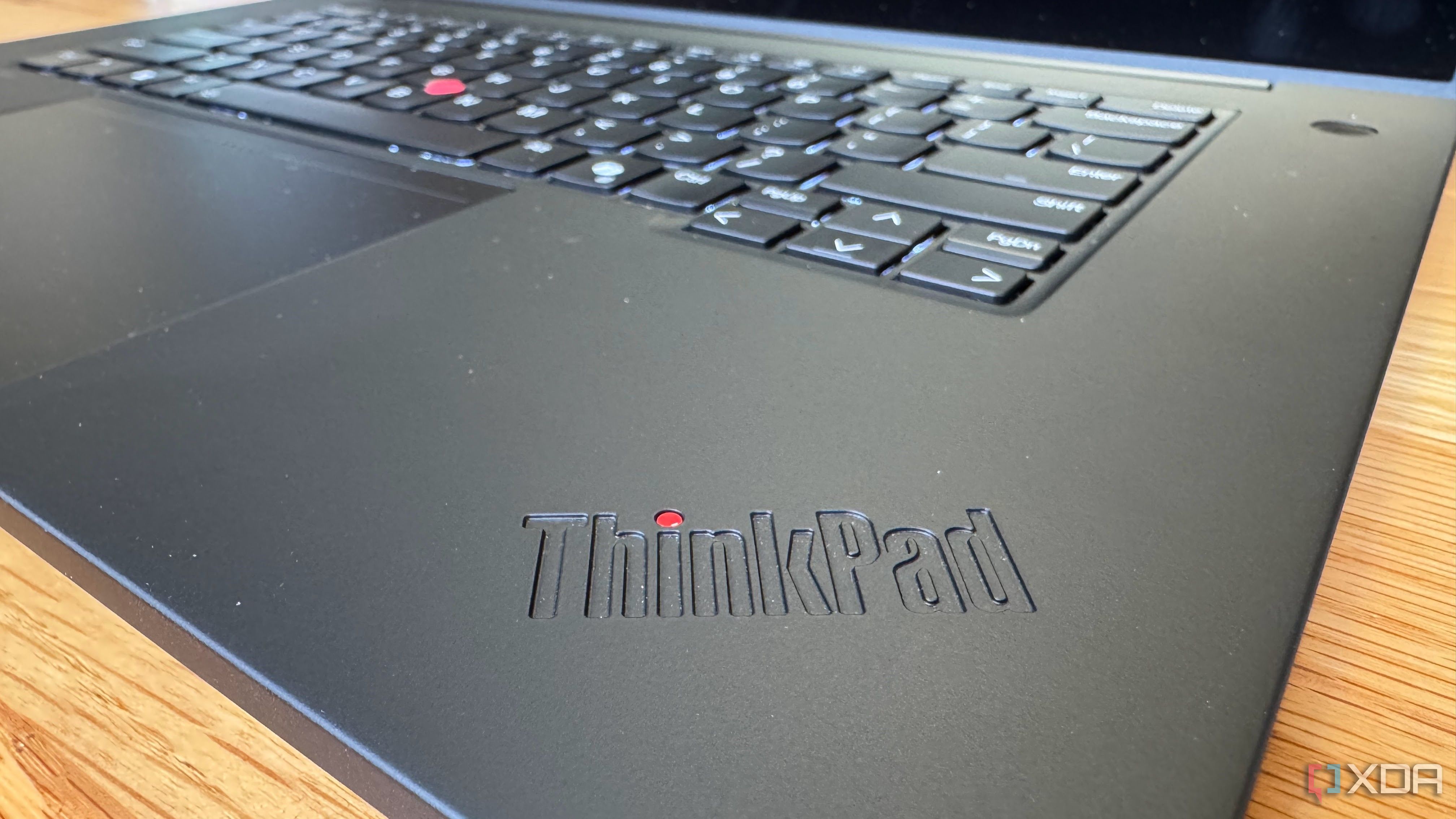 View of the Lenovo ThinkPad P16 Gen 7 from the corner with the ThinkPad logo, keyboard, trackpad, and dispaly visible