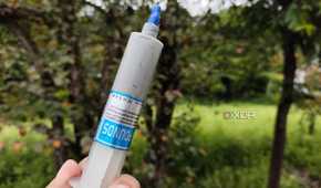 A person holding an Unbranded Thermal Paste