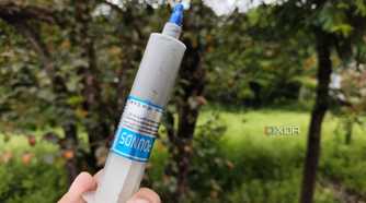 A person holding an Unbranded Thermal Paste