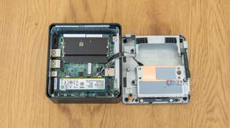 Top-down view of the Asus NUC 14 Pro with the bottom cover and Data drive bay sitting next to it