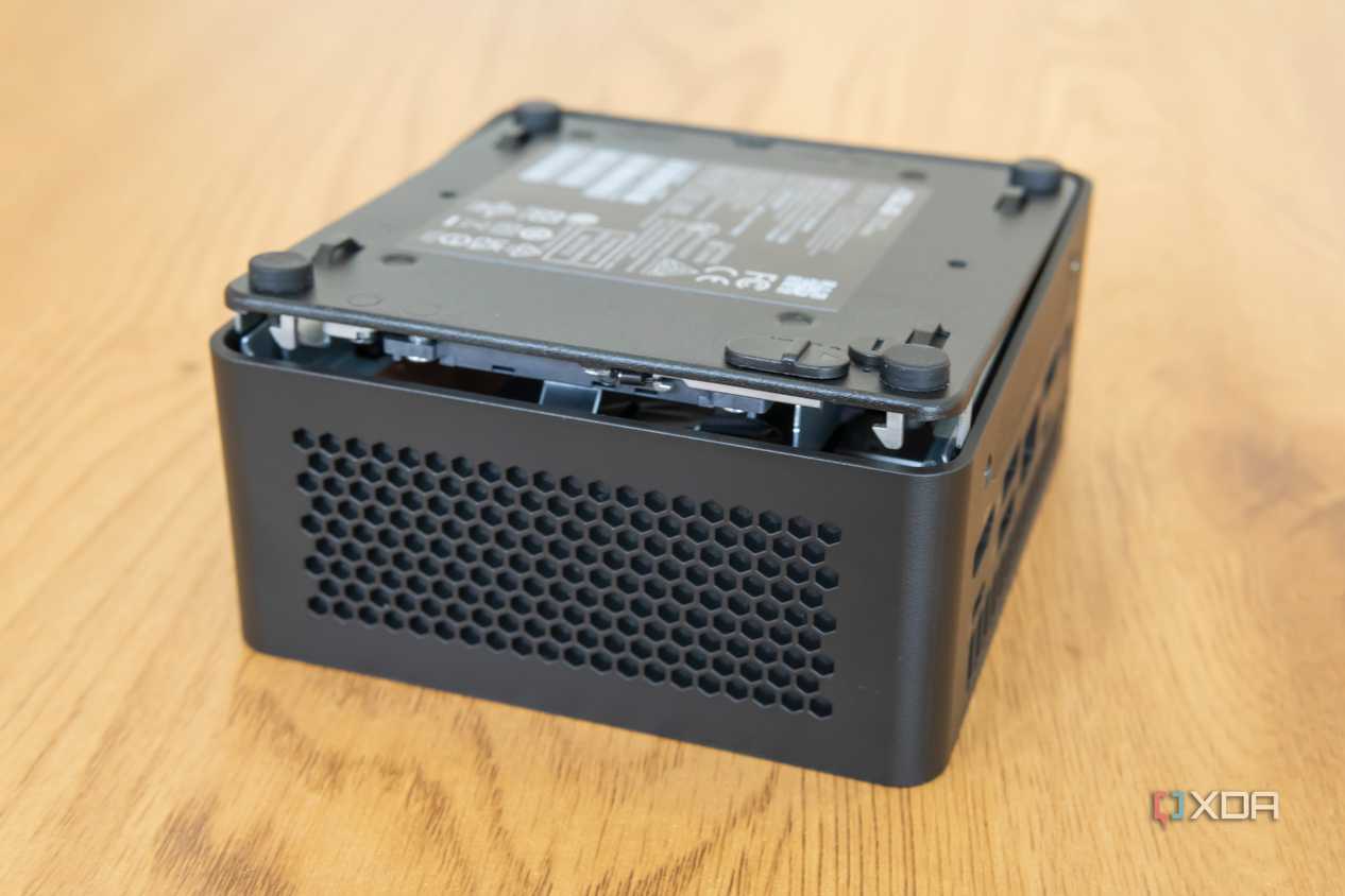 Asus NUC 14 Pro with the bottom cover lifted slightly from the chassis